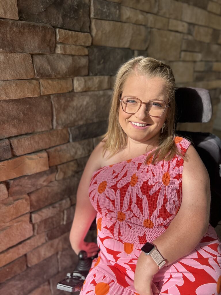 Sara Gaver in a pink floral dress