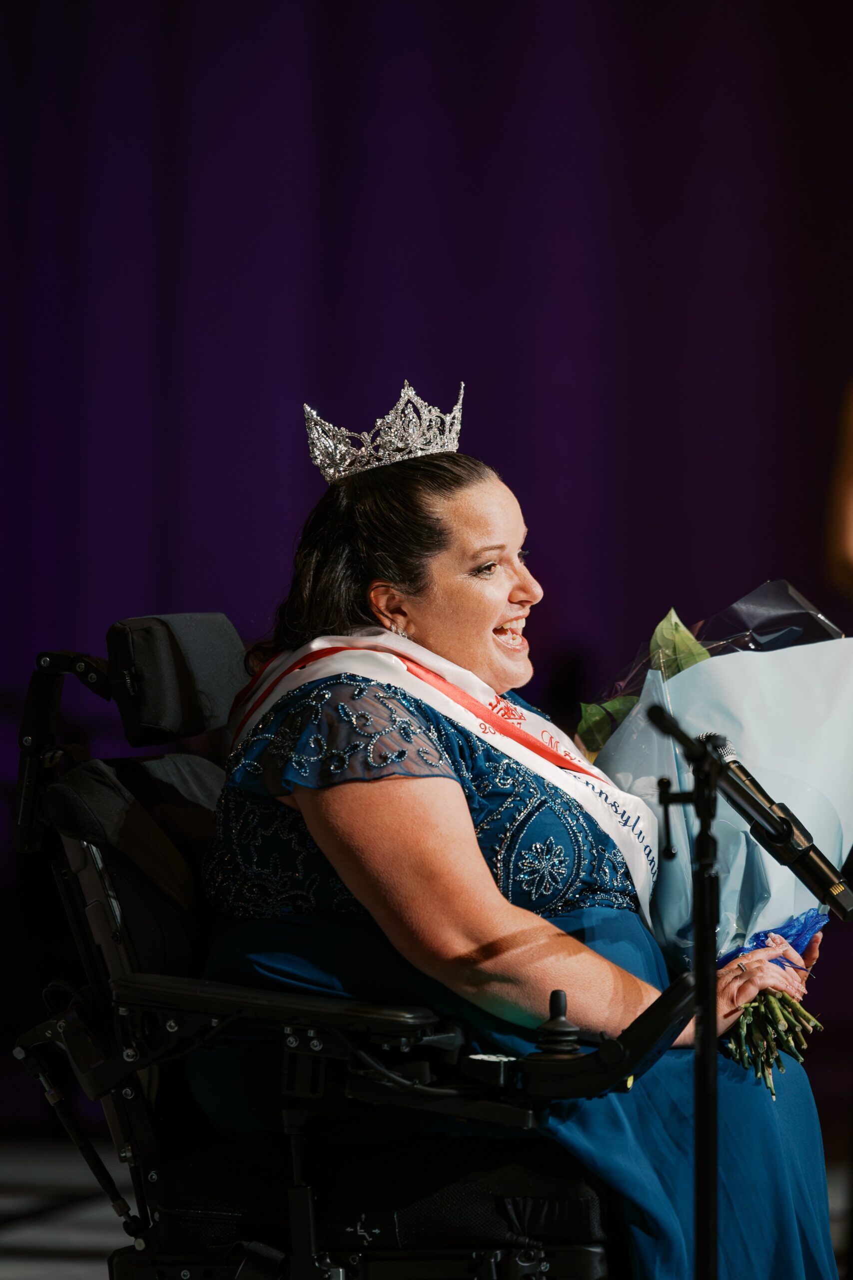 Ms. Wheelchair America 2027 Jamie Clendening giving her acceptance speech from her power wheelchair