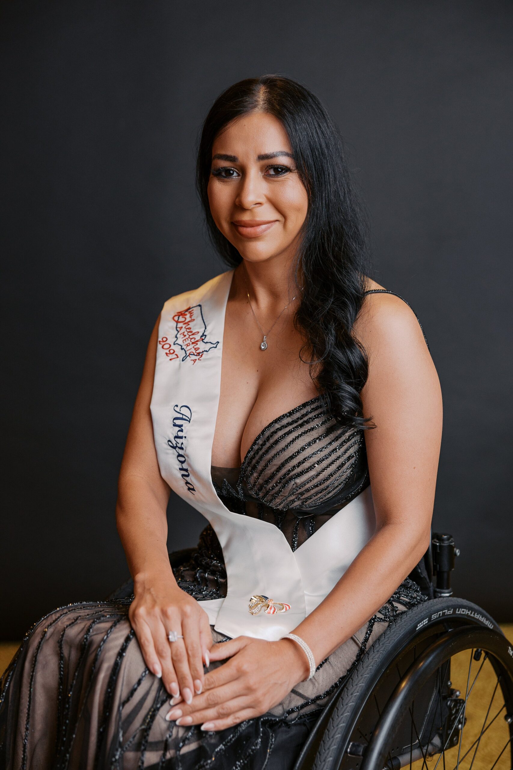 Carla Sanders, Ms. Wheelchair Arizona, seated in her wheelchair for her Ms. Wheelchair America 2027 delegate portrait