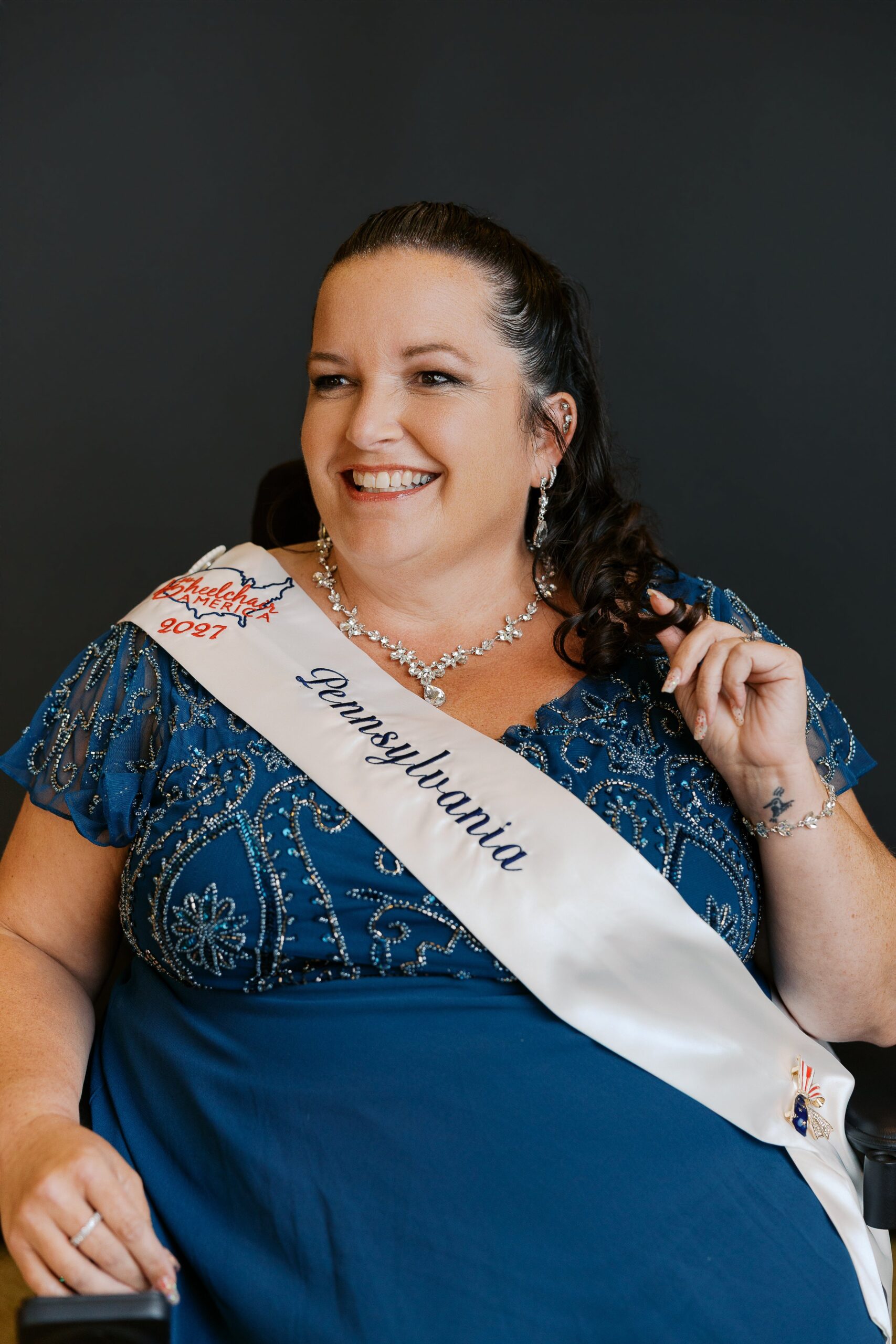 Jamie Clendening, Ms. Wheelchair Pennsylvania and Ms. Wheelchair America 2027, seated in her power wheelchair for her delegate portrait
