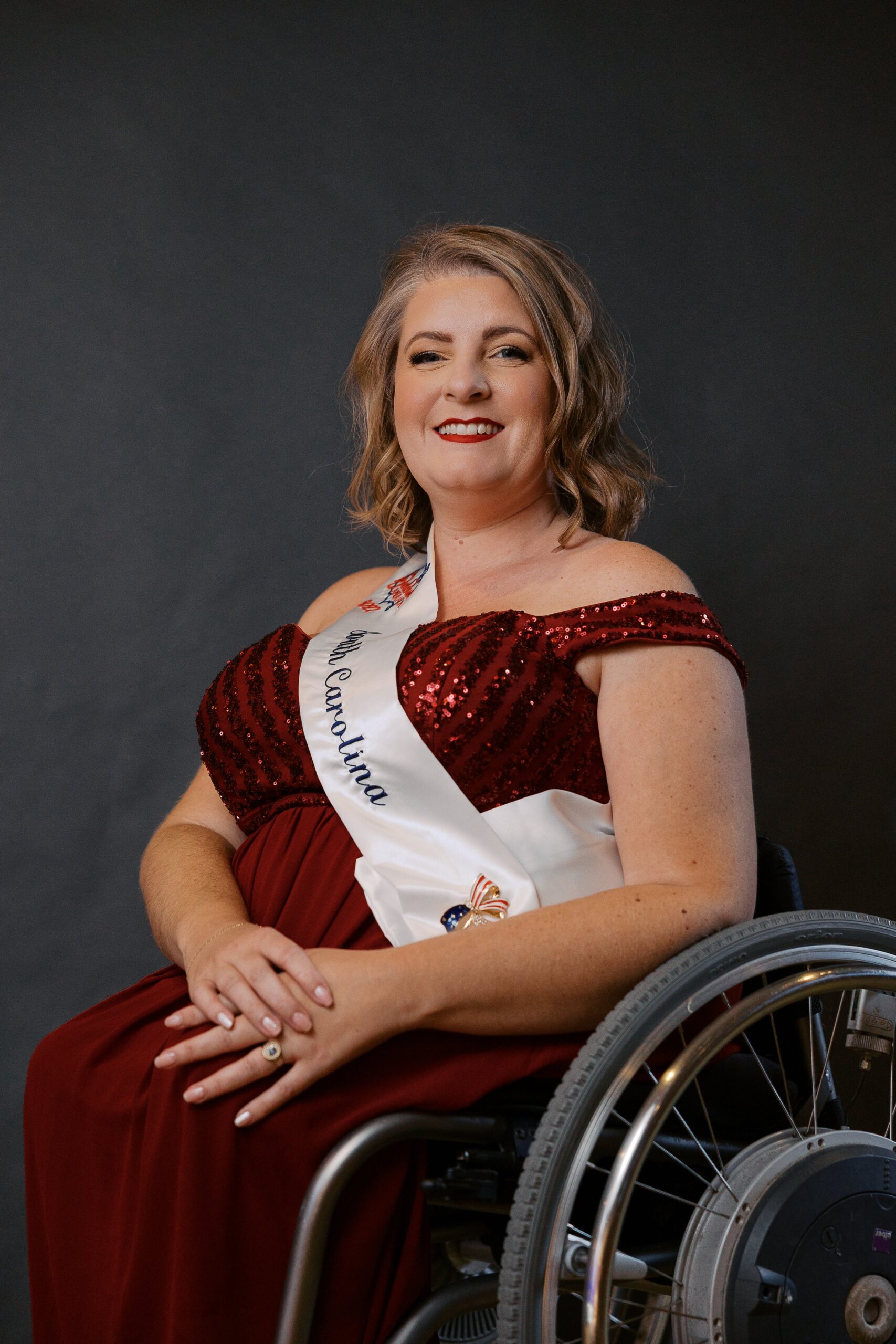 Sarah Kinney, Ms. Wheelchair South Carolina, seated in her wheelchair for her Ms. Wheelchair America 2027 delegate portrait