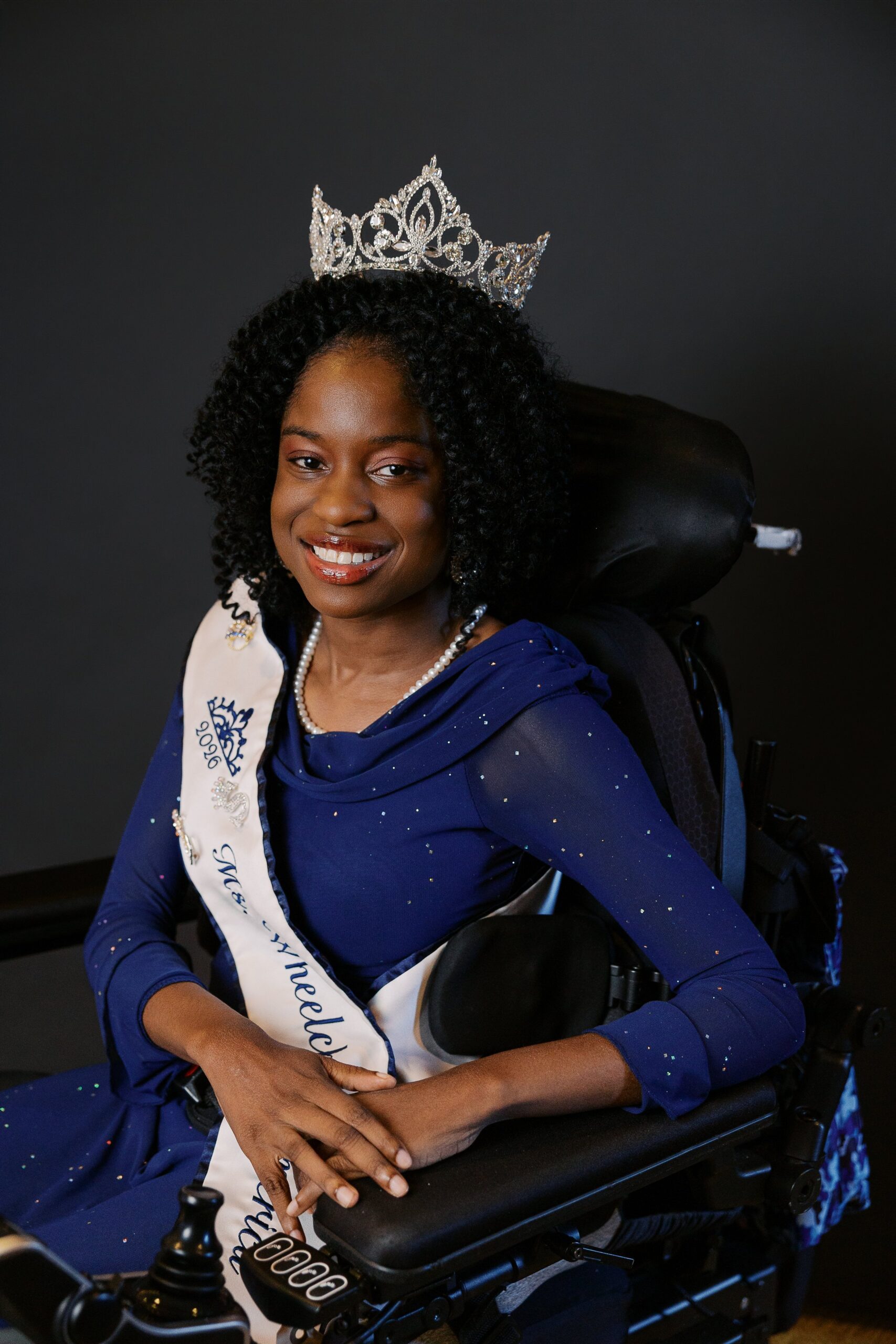 Latavia Sturdivant, Ms. Wheelchair America 2026, wearing her crown and seated in her power wheelchair